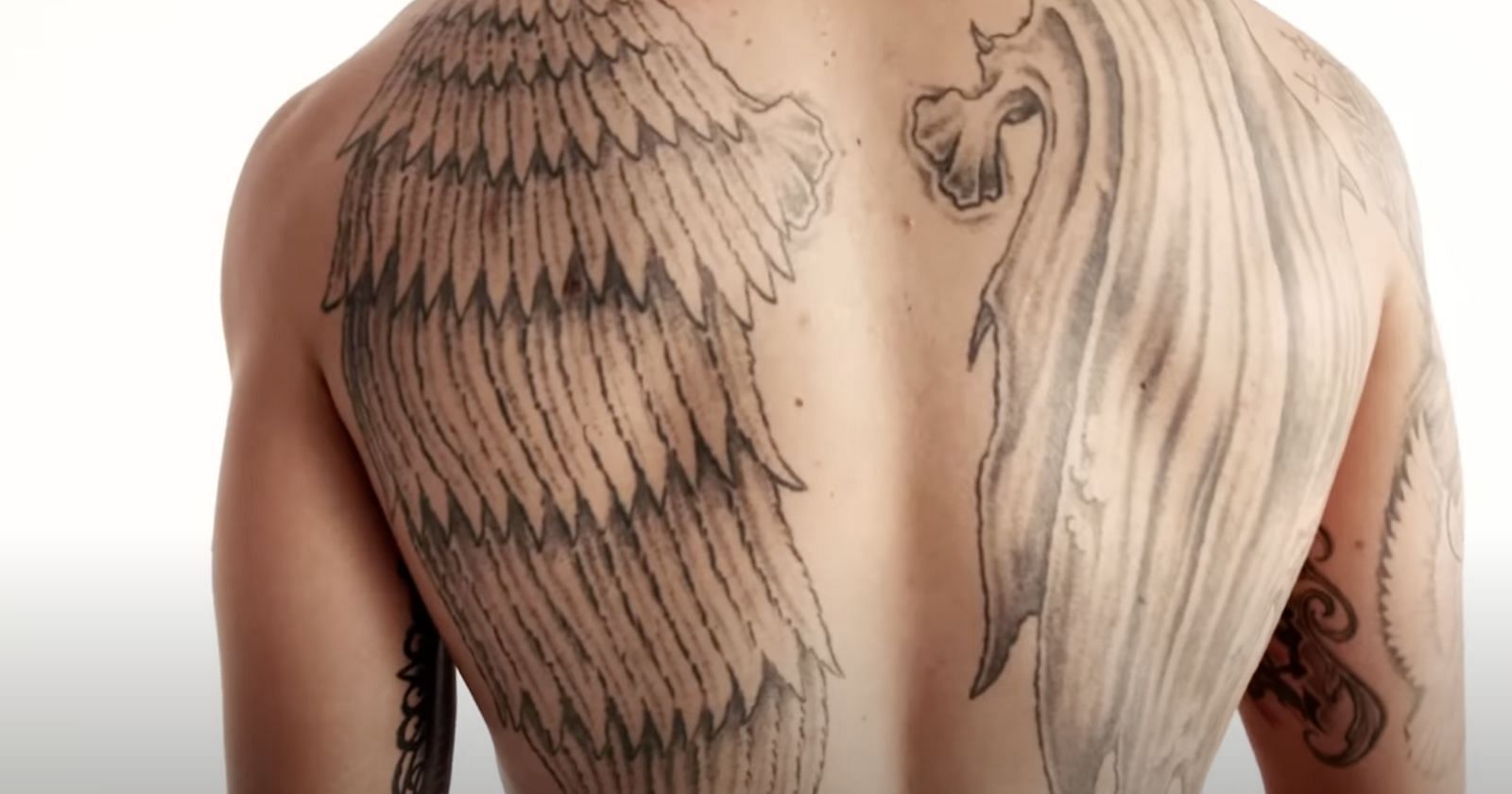 Exploring Max Holloway's Back Tattoo: A Symbol of Balance and Sacrifice